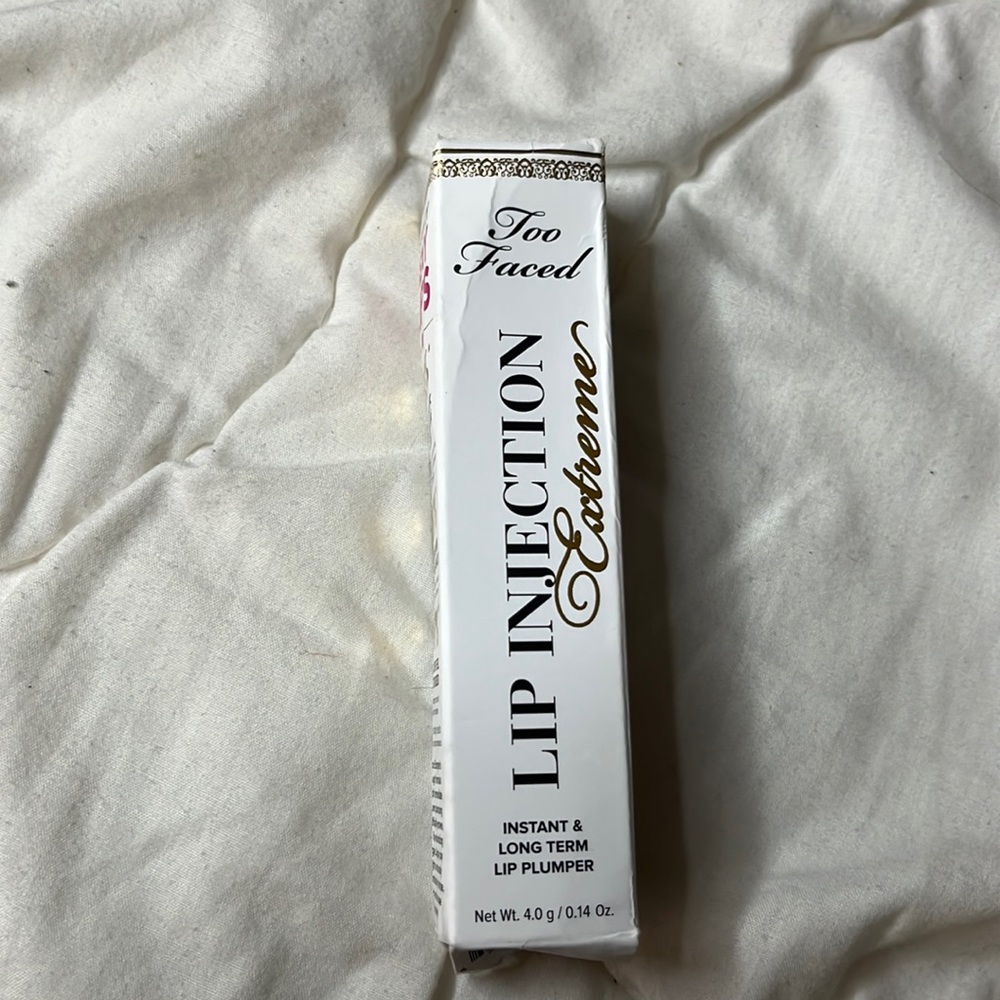 BRAND NEW lip plumper!  (box was stepped on)